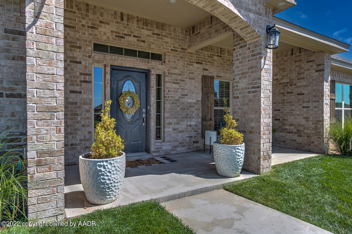 6103 Bowery Amarillo, TX 79119 - Photo 3 of 23 a front view of a house with outdoor seating