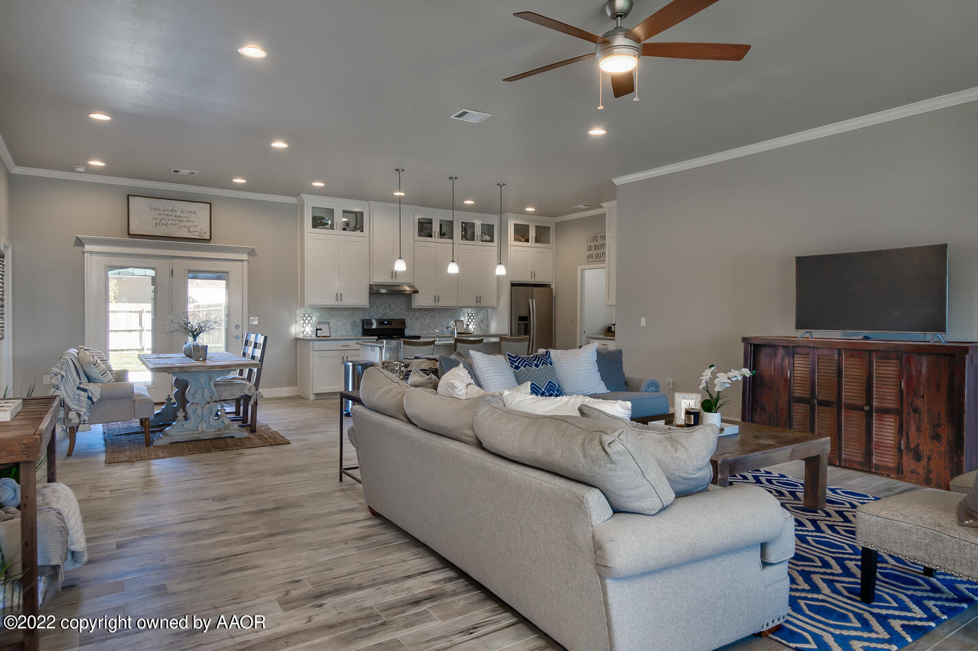 6103 Bowery Amarillo, TX 79119 - Photo 5 of 23 a living room with furniture and a flat screen tv