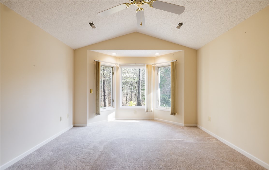 47 Gulf Stream Lane Salem, SC 29676 - Photo 11 of 48 This airy room features a vaulted ceiling and bay window, offering serene tree views.