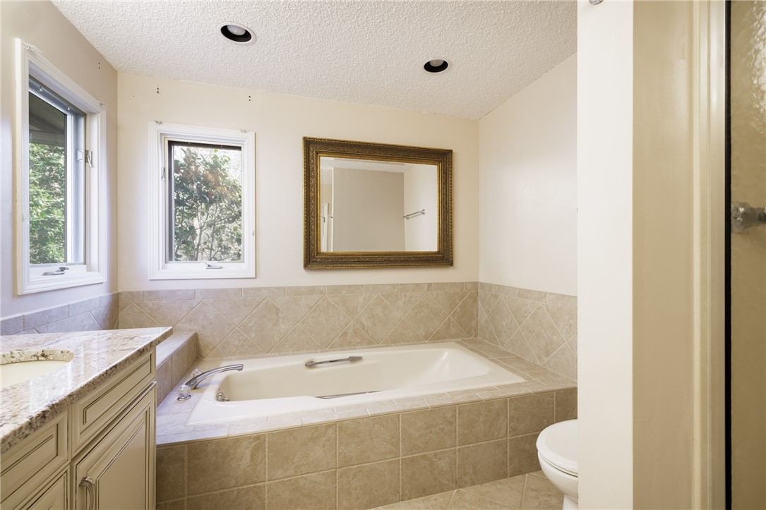 47 Gulf Stream Lane Salem, SC 29676 - Photo 14 of 48 This bright bathroom features a spacious tub and vanity, perfect for unwinding.