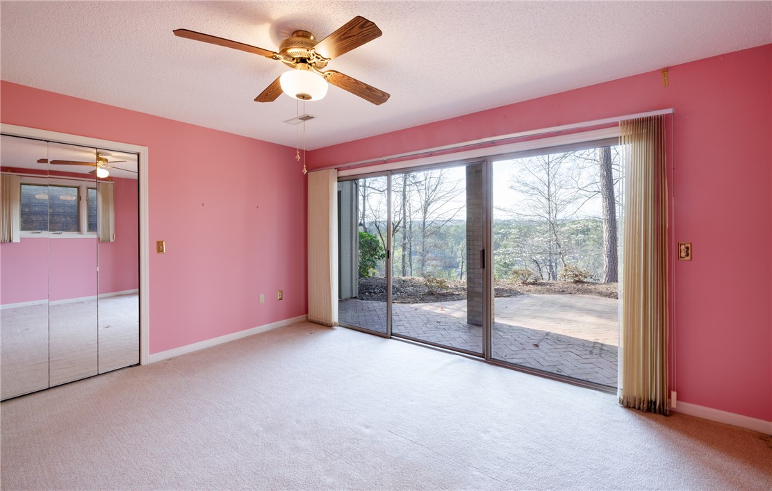 47 Gulf Stream Lane Salem, SC 29676 - Photo 17 of 48 This spacious room offers comfort and direct access to an outdoor patio with scenic views.