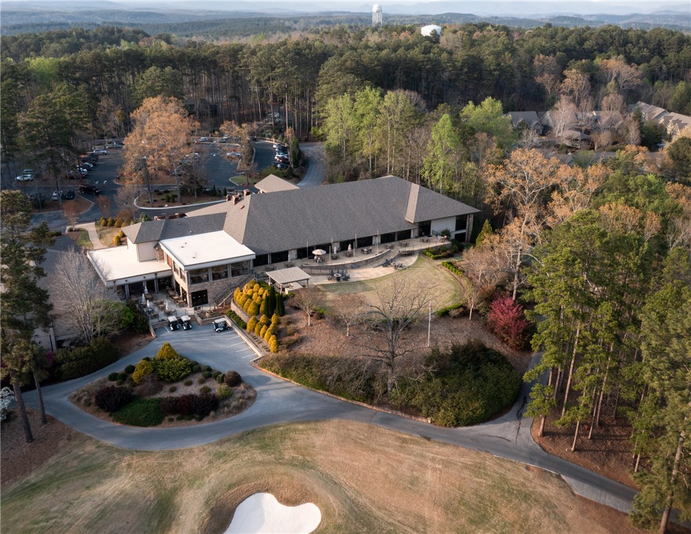 47 Gulf Stream Lane Salem, SC 29676 - Photo 32 of 48 An aerial perspective reveals the golf course and expansive clubhouse nestled amongst the trees.