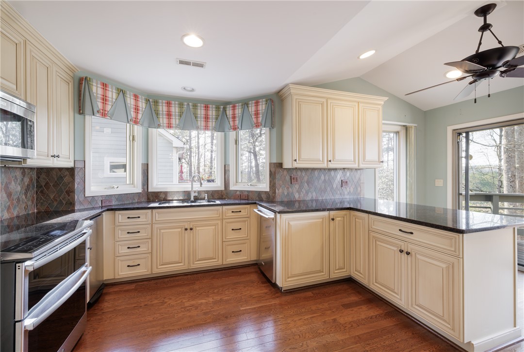 47 Gulf Stream Lane Salem, SC 29676 - Photo 41 of 48 This spacious kitchen offers a delightful cooking experience with ample counter space and natural light.