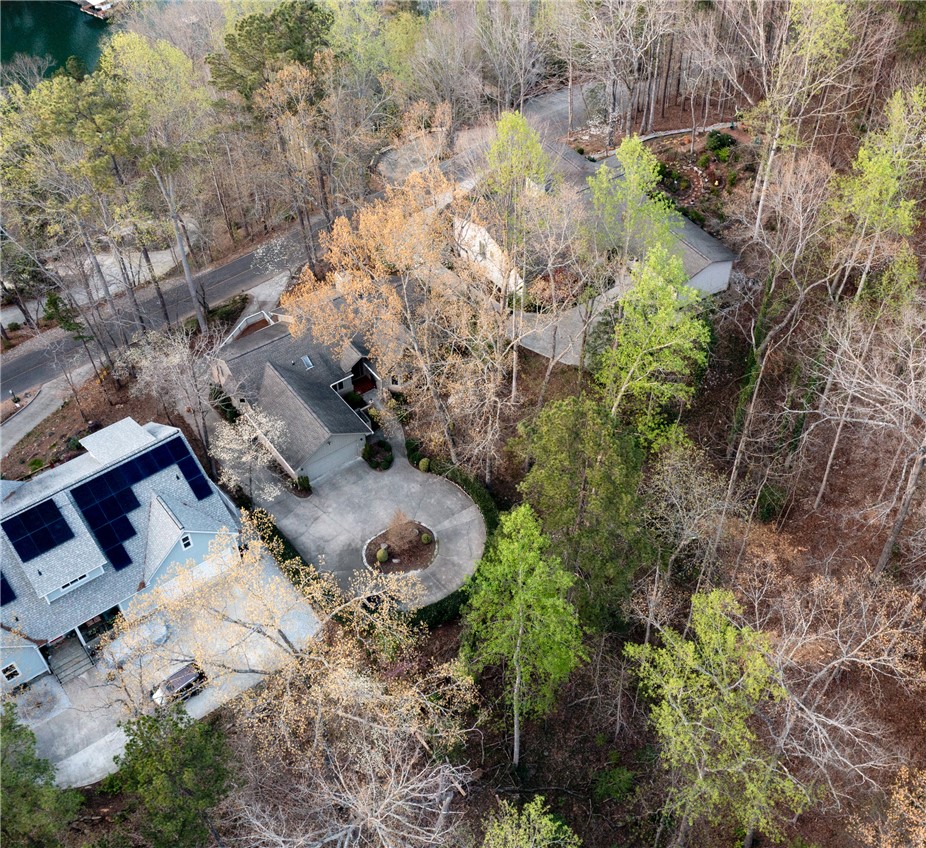 47 Gulf Stream Lane Salem, SC 29676 - Photo 44 of 48 This aerial view showcases a residential property nestled amidst lush natural surroundings with convenient access to a body of water.
