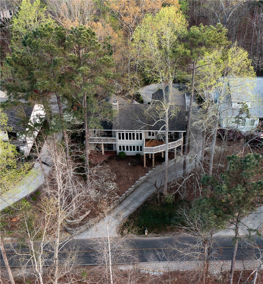 47 Gulf Stream Lane Salem, SC 29676 - Photo 48 of 48 Perched among verdant trees, this hillside residence offers captivating outdoor living spaces.