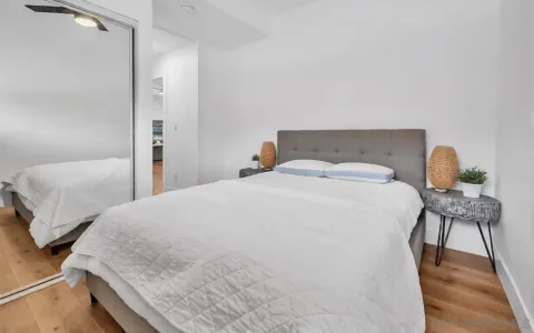 a bedroom with a bed and chair