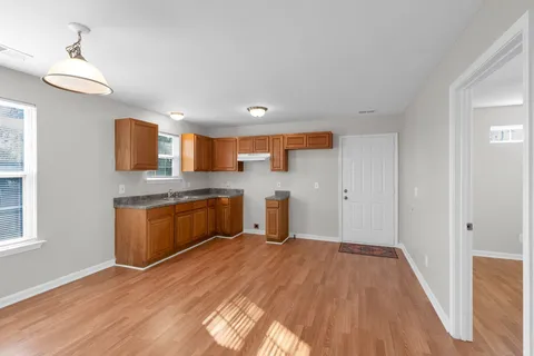a kitchen with a refrigerator and window