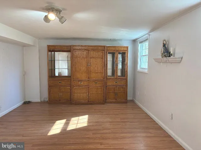 a view of a livingroom with wooden floor
