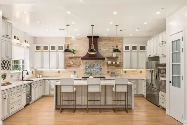 a large kitchen with lots of counter space and appliances