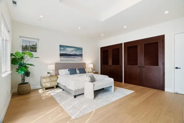 a spacious bathroom with a granite countertop sink a toilet and shower