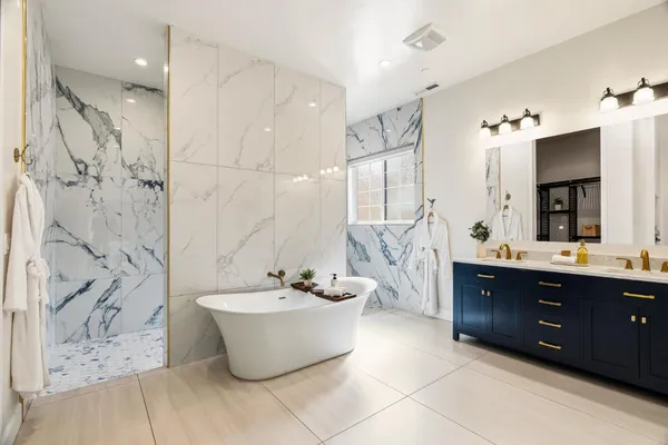 a bathroom with a toilet sink and shower