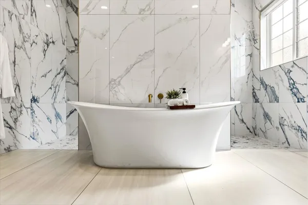 an empty room with windows and ceiling fan