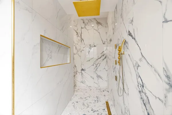 a kitchen with stainless steel appliances kitchen island granite countertop a table chairs stove and refrigerator