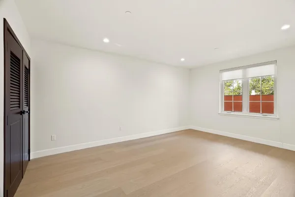 a front view of a house with a yard and outdoor space