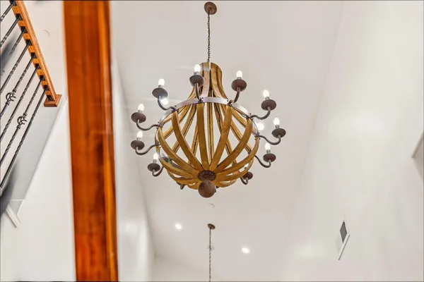 a view of a patio with couches and wooden floor