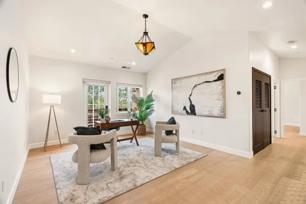 a view of a house with backyard porch and wooden floor