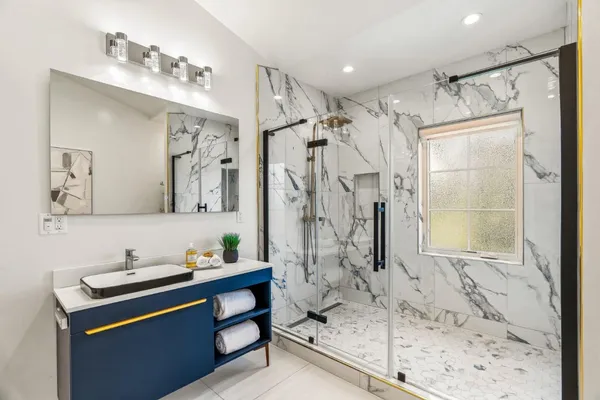 a view of a balcony with wooden floor and fence
