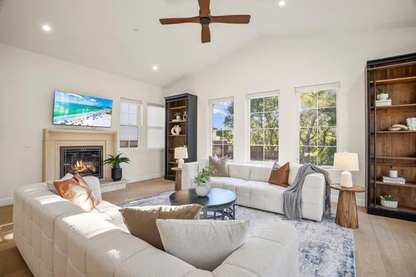a living room with furniture and a large window