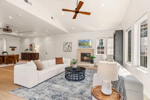 a large kitchen with stainless steel appliances kitchen island granite countertop a large island in the center