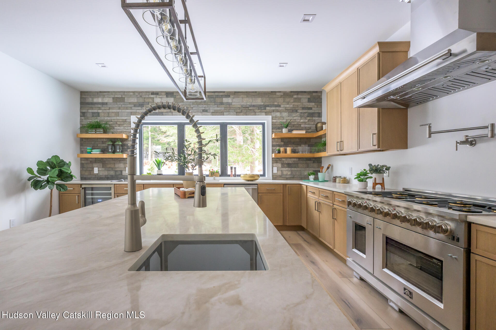 305 Mitchell Hollow Road Windham, NY 12496 - Photo 13 of 39 a large white kitchen with a large window