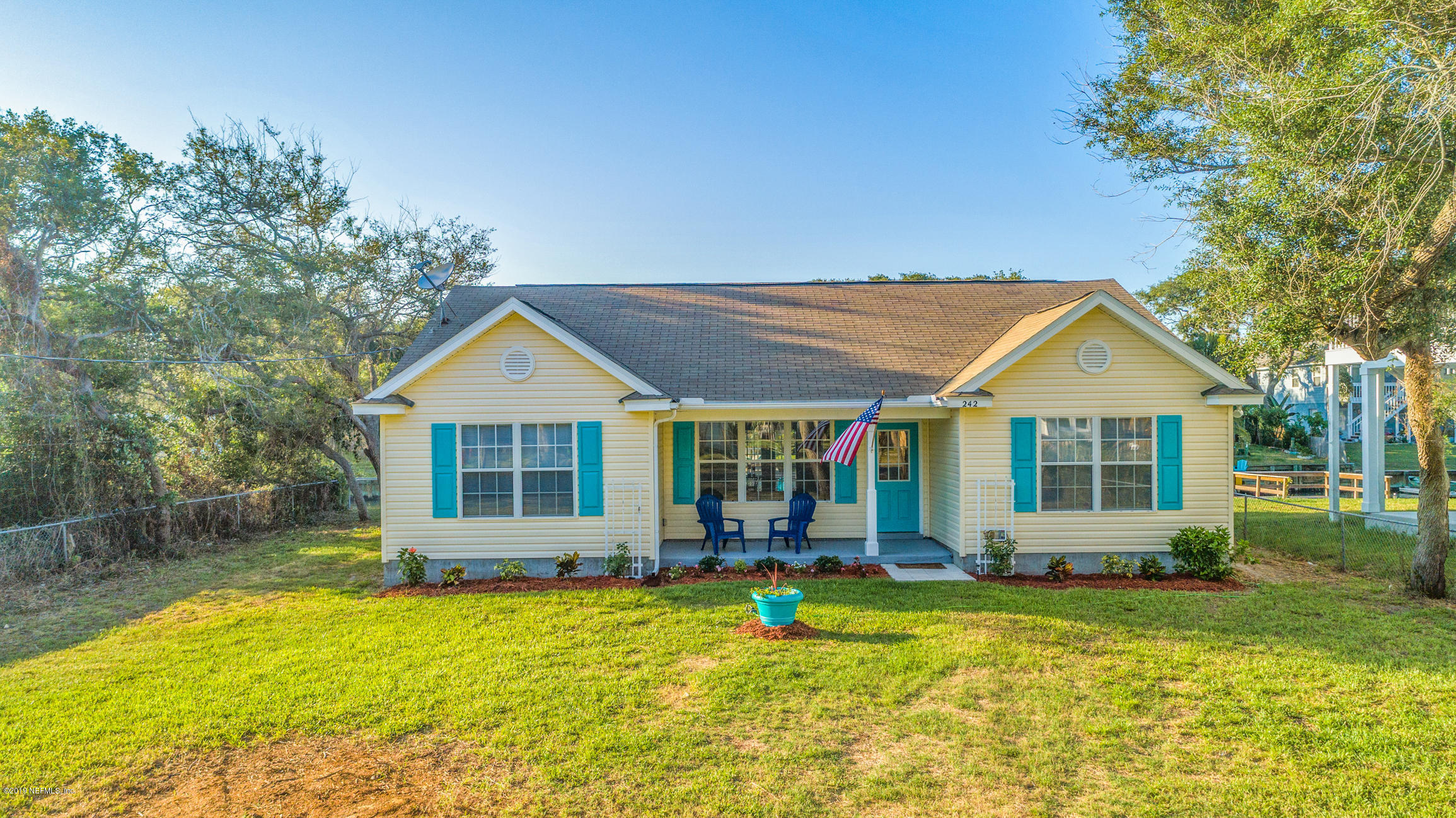 242 Puebla Road St. Augustine, FL 32080 - Photo 1 of 48 front view of a house with a yard