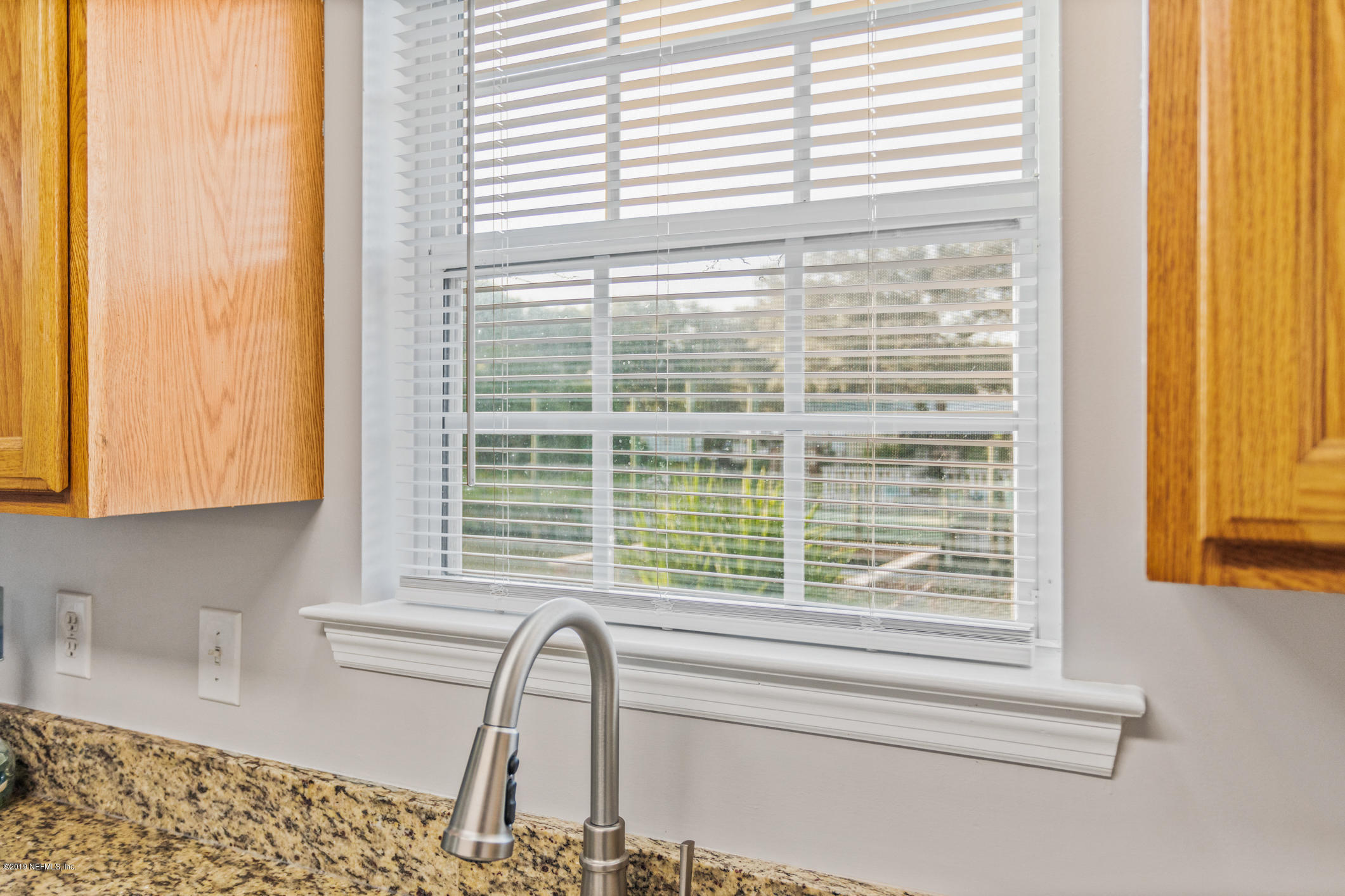 242 Puebla Road St. Augustine, FL 32080 - Photo 19 of 48 a view of a window and a kitchen