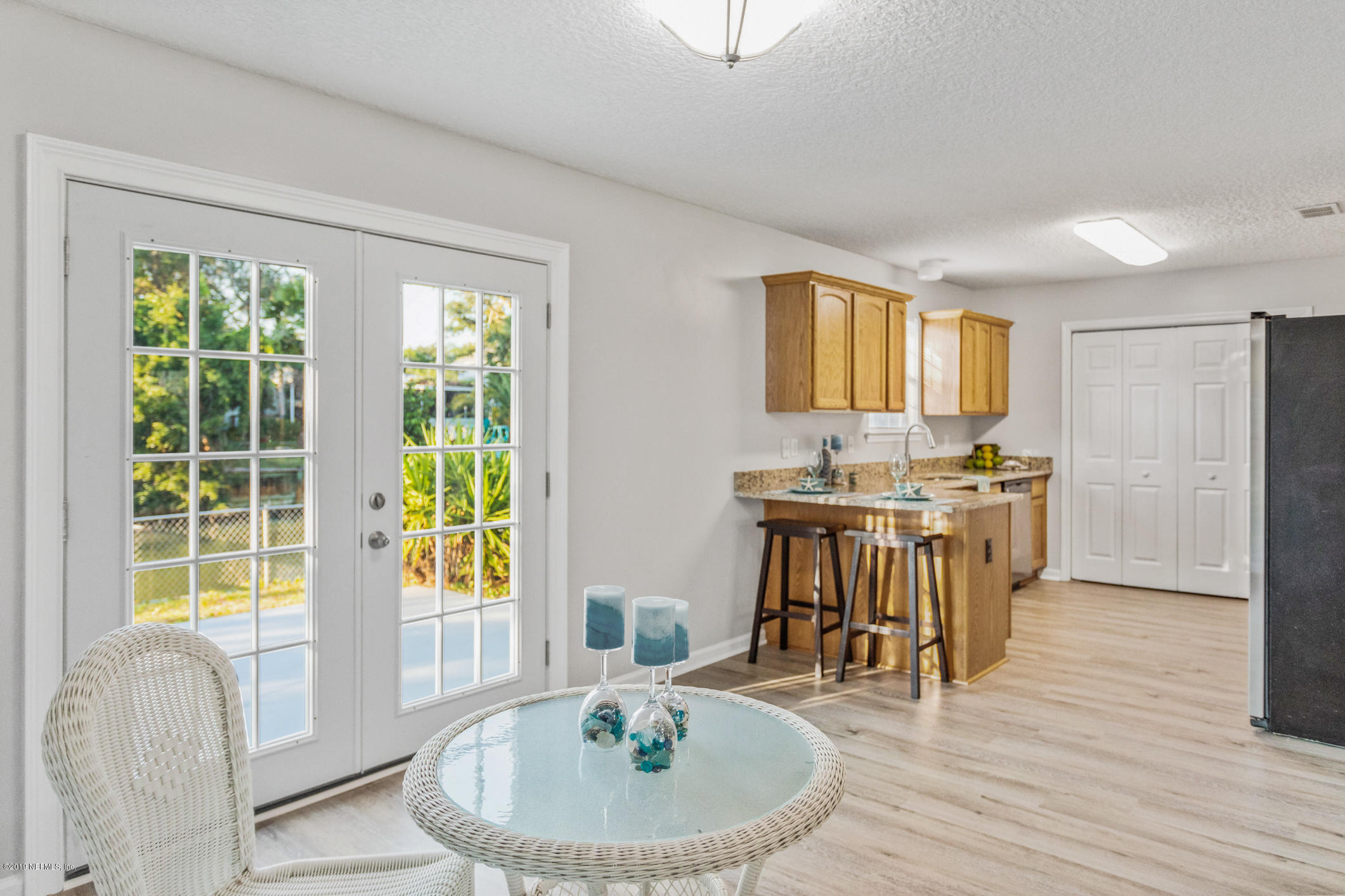 242 Puebla Road St. Augustine, FL 32080 - Photo 22 of 48 a view of a dining room with furniture and wooden floor