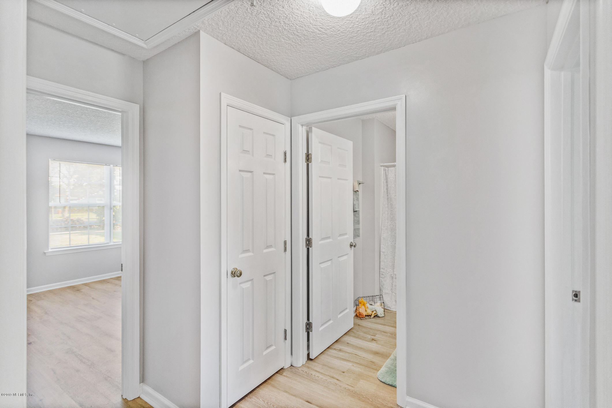 242 Puebla Road St. Augustine, FL 32080 - Photo 24 of 48 a view of a hallway with wooden floor and closet