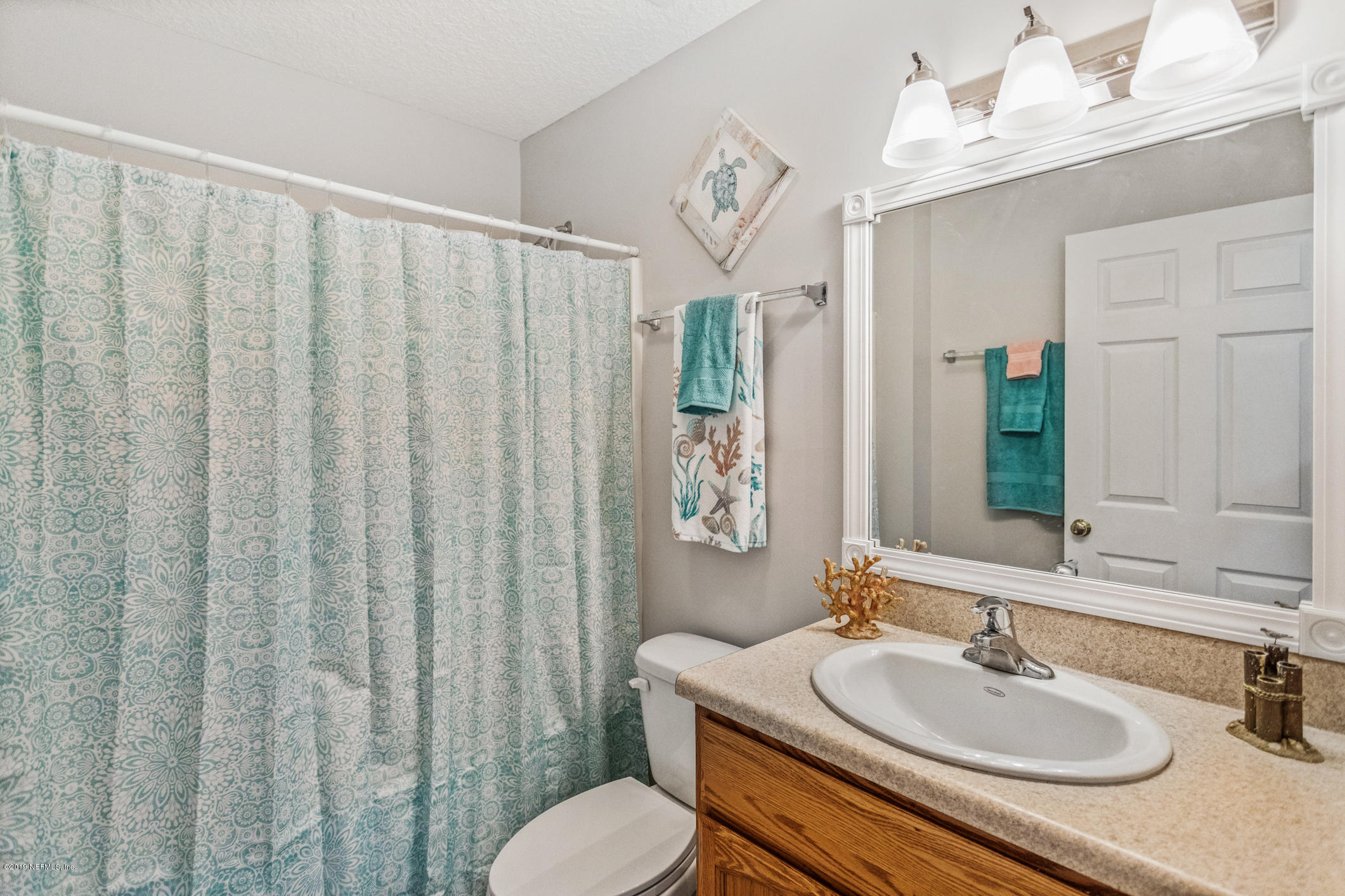 242 Puebla Road St. Augustine, FL 32080 - Photo 25 of 48 a bathroom with a sink toilet and shower