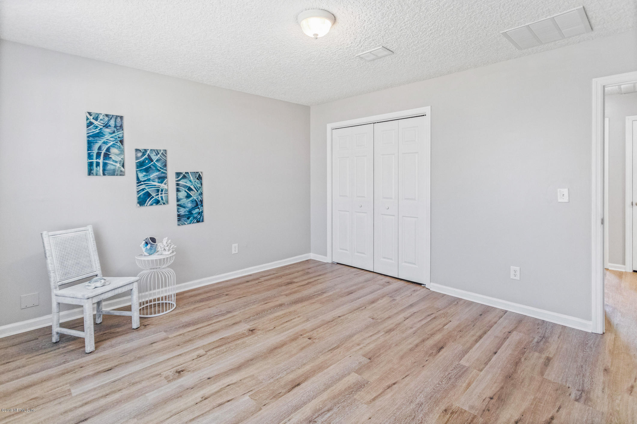 242 Puebla Road St. Augustine, FL 32080 - Photo 27 of 48 a view of wooden floor and chairs in a room