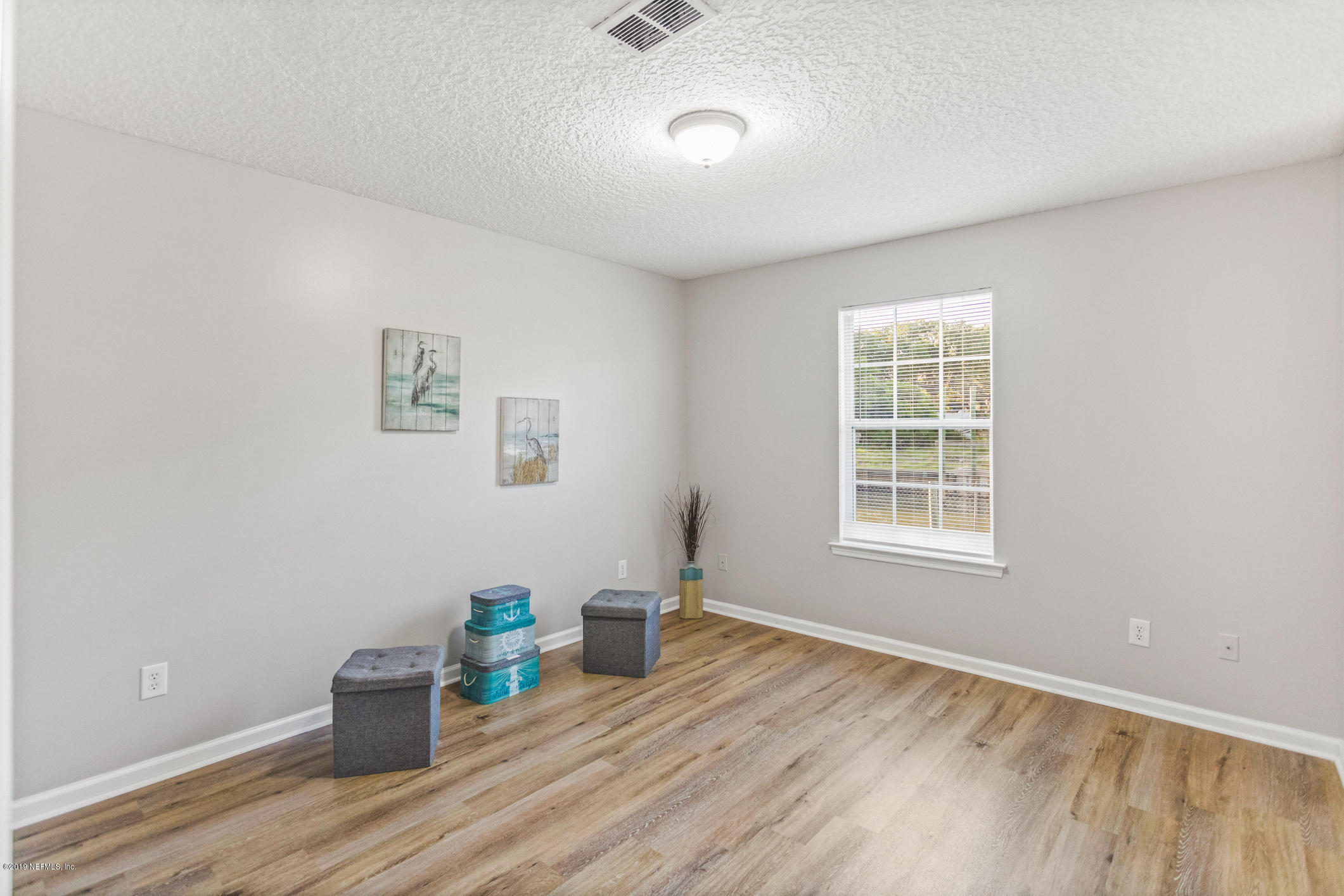 242 Puebla Road St. Augustine, FL 32080 - Photo 28 of 48 an empty room with a wooden floor and a window