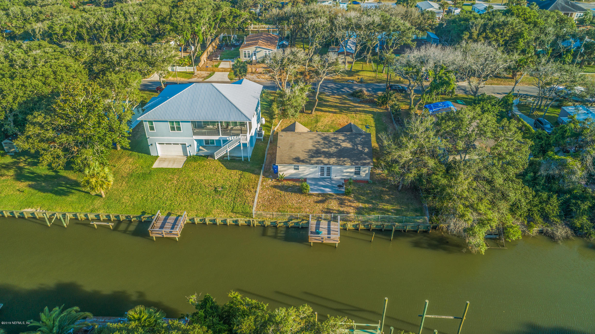 242 Puebla Road St. Augustine, FL 32080 - Photo 3 of 48 an aerial view of residential houses with outdoor space and lake view