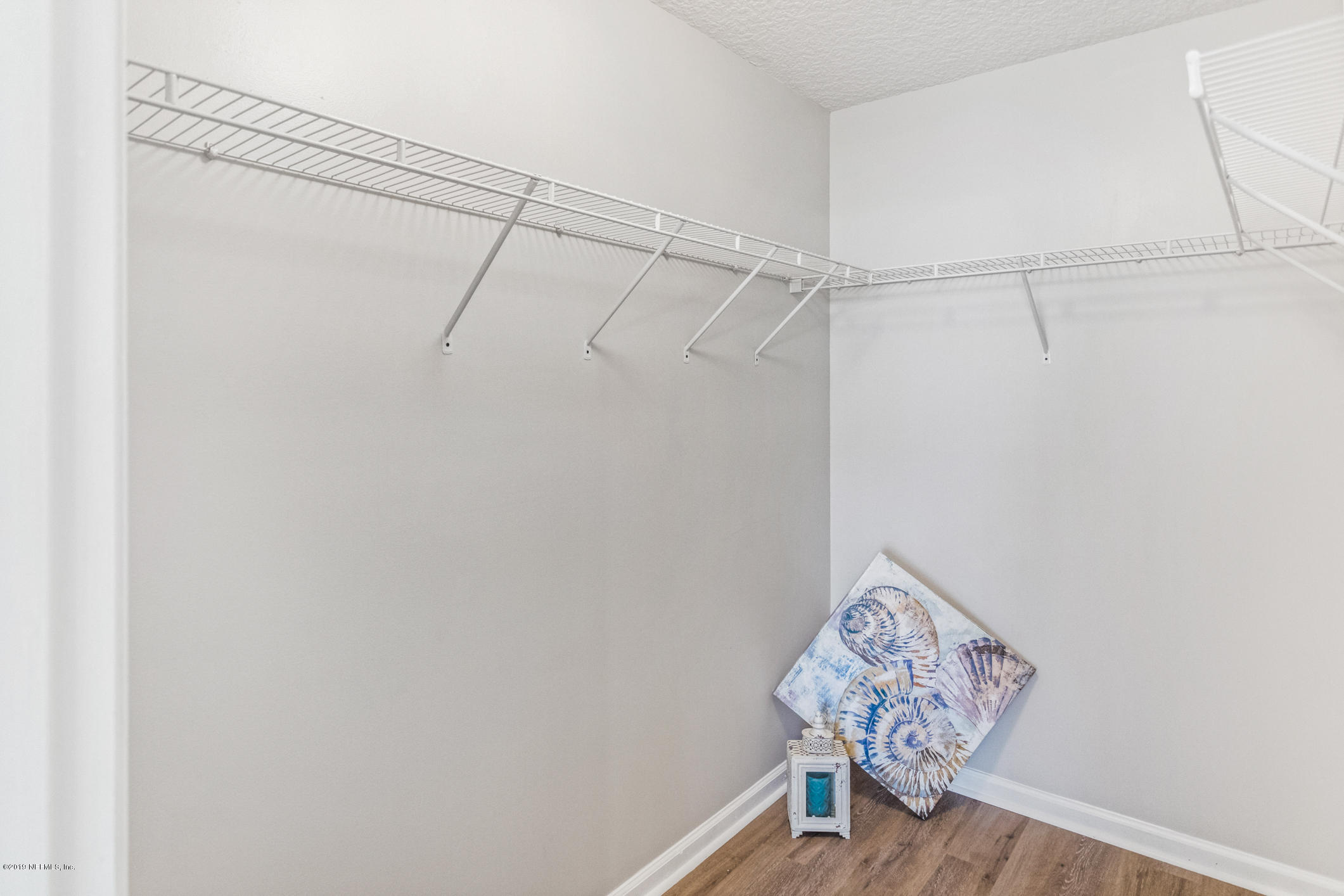 242 Puebla Road St. Augustine, FL 32080 - Photo 32 of 48 a view of small space with racks on the wall