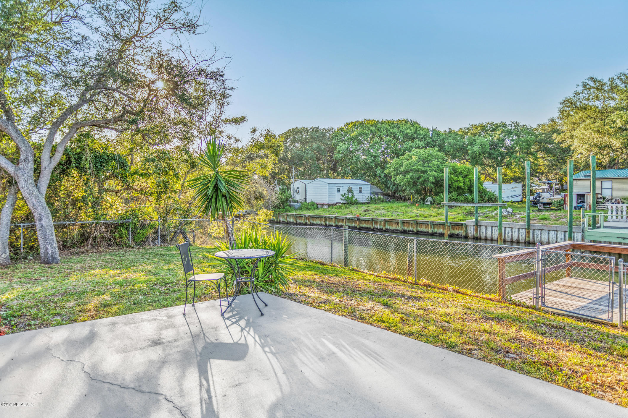 242 Puebla Road St. Augustine, FL 32080 - Photo 34 of 48 a view of a lake with a house in the background
