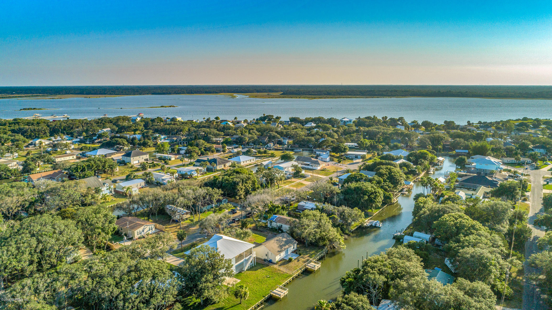 242 Puebla Road St. Augustine, FL 32080 - Photo 4 of 48 an aerial view of a house with a lake view