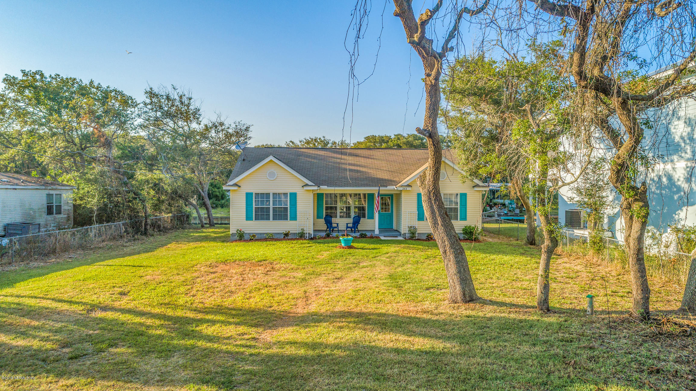 242 Puebla Road St. Augustine, FL 32080 - Photo 42 of 48 a view of a house with pool and a yard
