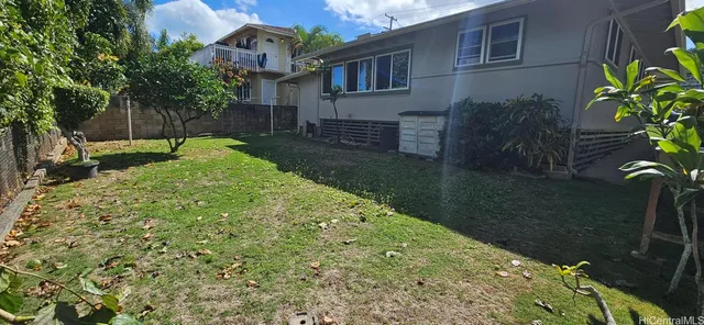 a view of a house with backyard porch and sitting area