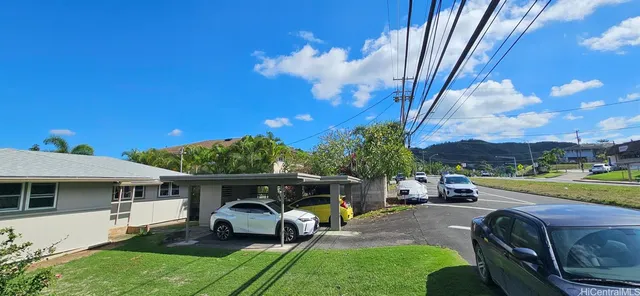 a view of a patio with a table and chairs