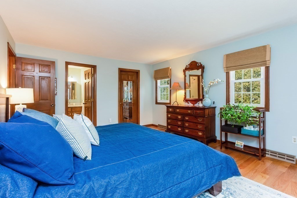 218 Somers Road Hampden, MA 01036 - Photo 16 of 32 a bedroom with a bed and wooden floor