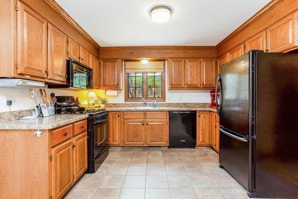 218 Somers Road Hampden, MA 01036 - Photo 10 of 32 a kitchen with stainless steel appliances granite countertop a refrigerator stove top oven and sink