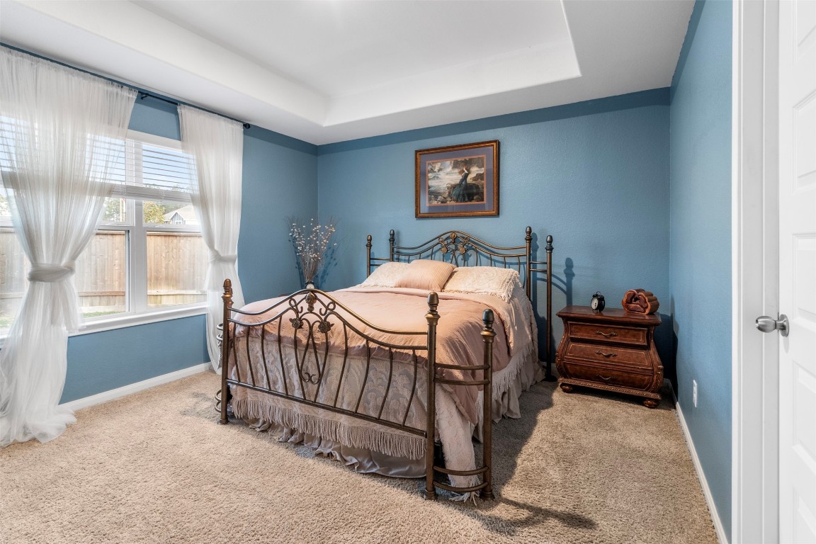 22565 Cormorant Court Splendora, TX 77372 - Photo 18 of 31 a bedroom with a bed and a window