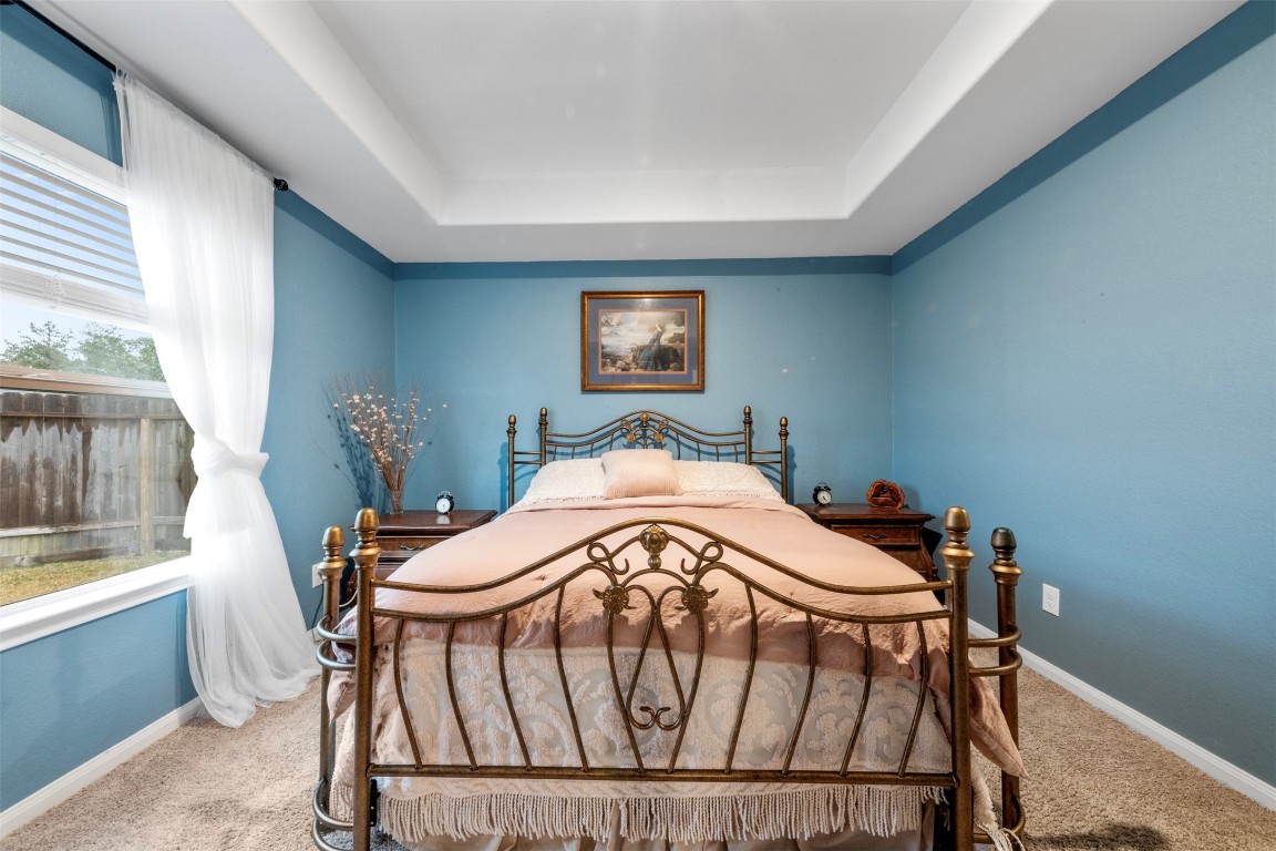 22565 Cormorant Court Splendora, TX 77372 - Photo 19 of 31 a bedroom with a bed and a window