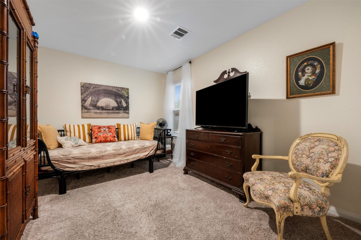 22565 Cormorant Court Splendora, TX 77372 - Photo 21 of 31 a living room with furniture and a flat screen tv