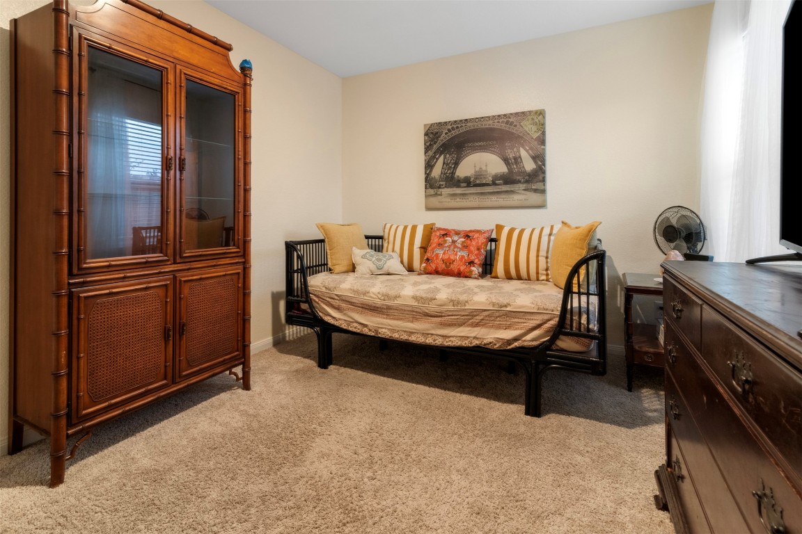 22565 Cormorant Court Splendora, TX 77372 - Photo 22 of 31 a living room with furniture and a dresser