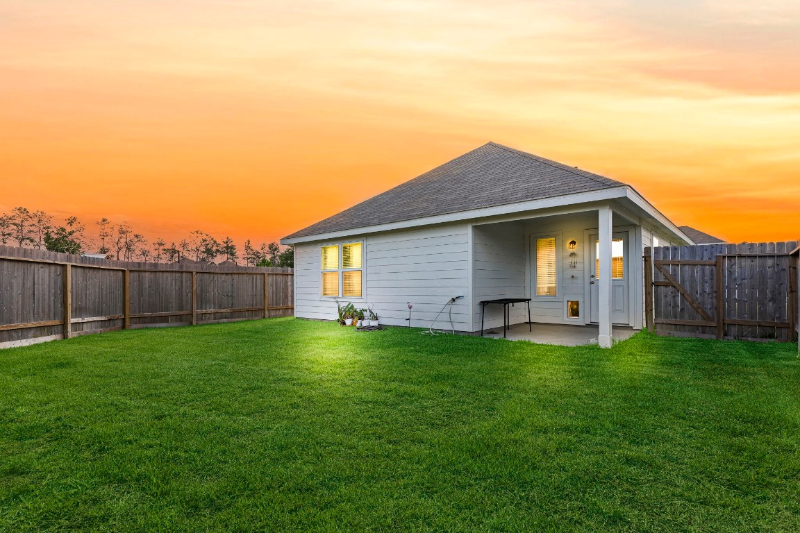 22565 Cormorant Court Splendora, TX 77372 - Photo 27 of 31 a view of a backyard with a garden
