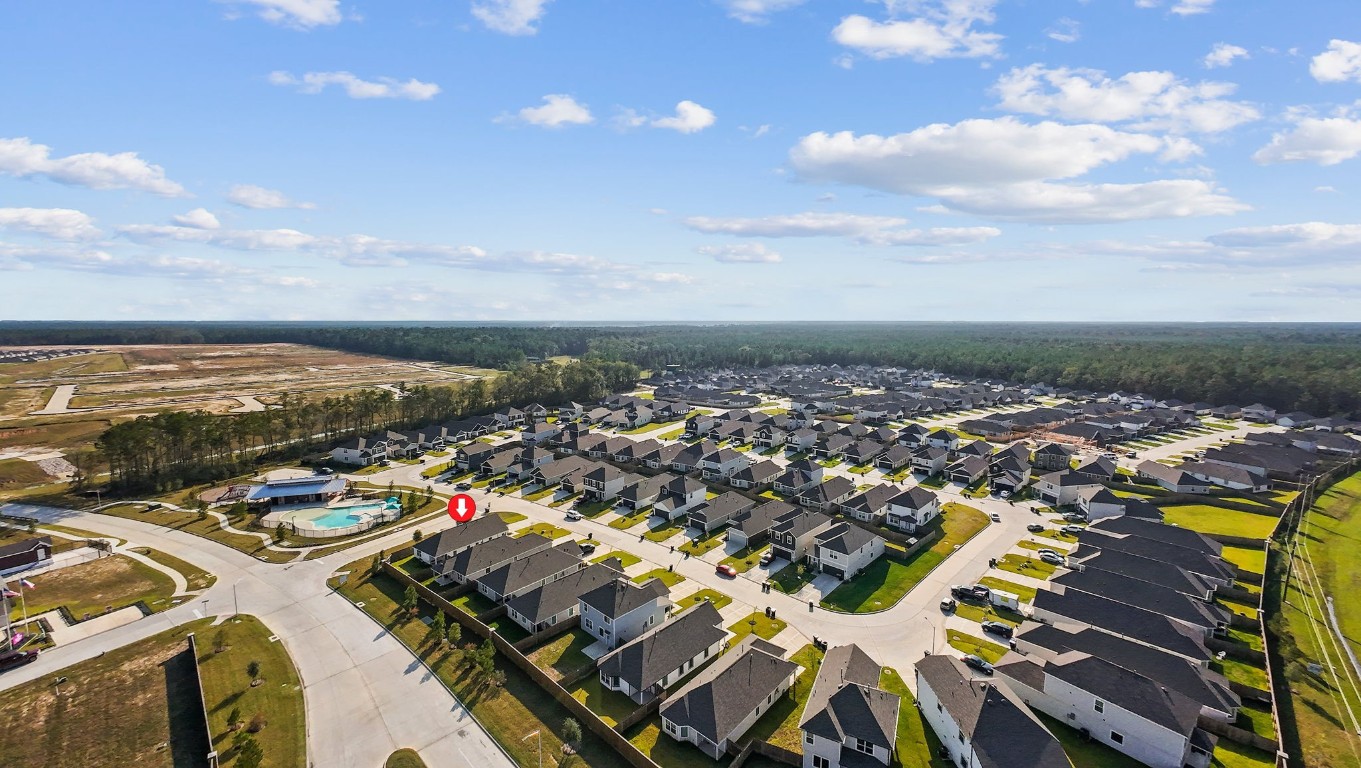 22565 Cormorant Court Splendora, TX 77372 - Photo 28 of 31 an aerial view of residential building and lake