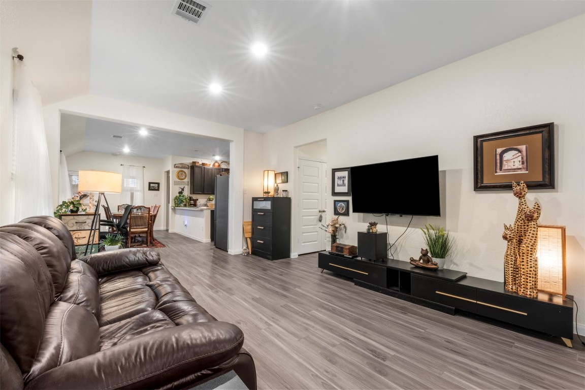 22565 Cormorant Court Splendora, TX 77372 - Photo 3 of 31 a living room with furniture and a flat screen tv