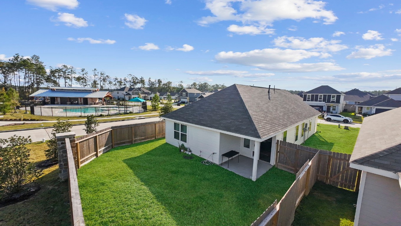 22565 Cormorant Court Splendora, TX 77372 - Photo 4 of 31 a view of a house with a yard and sitting area