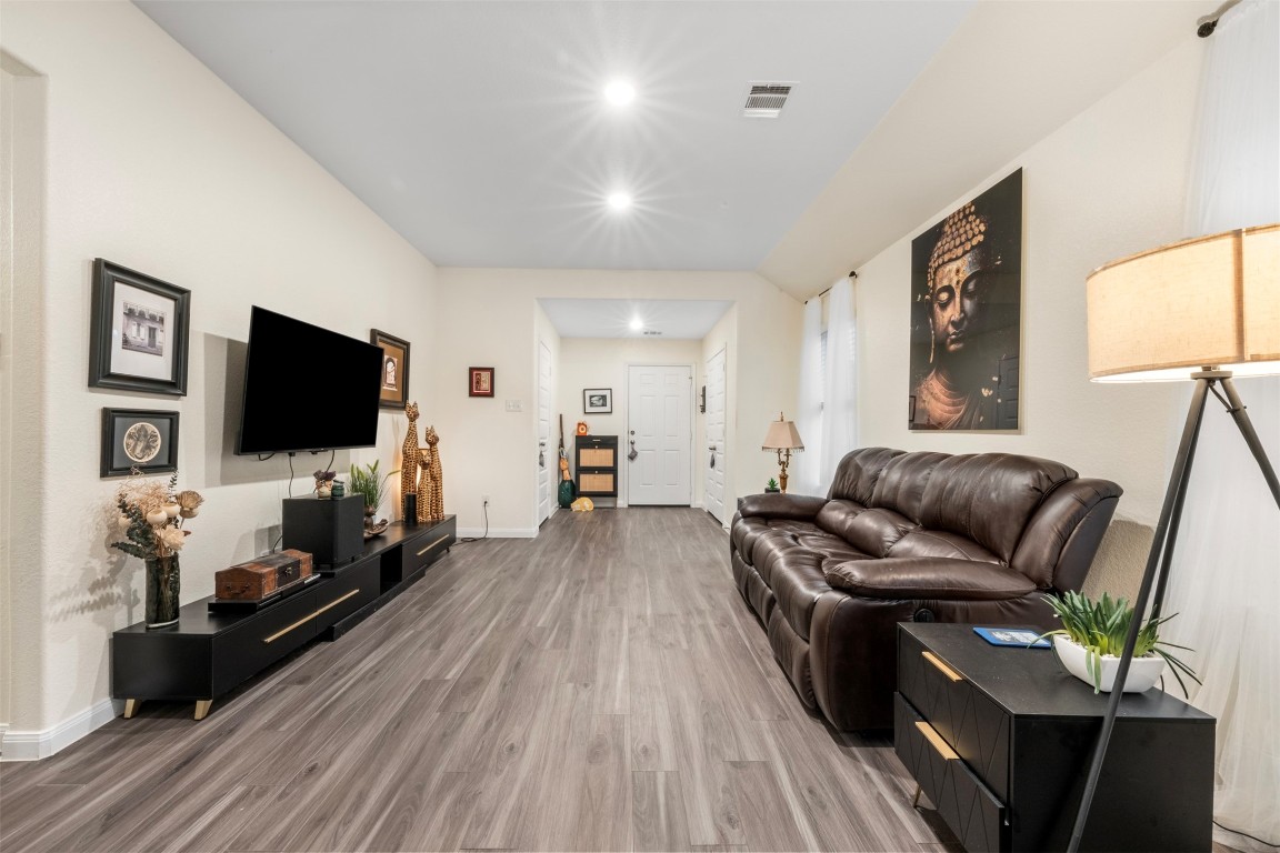 22565 Cormorant Court Splendora, TX 77372 - Photo 8 of 31 a living room with furniture and a flat screen tv