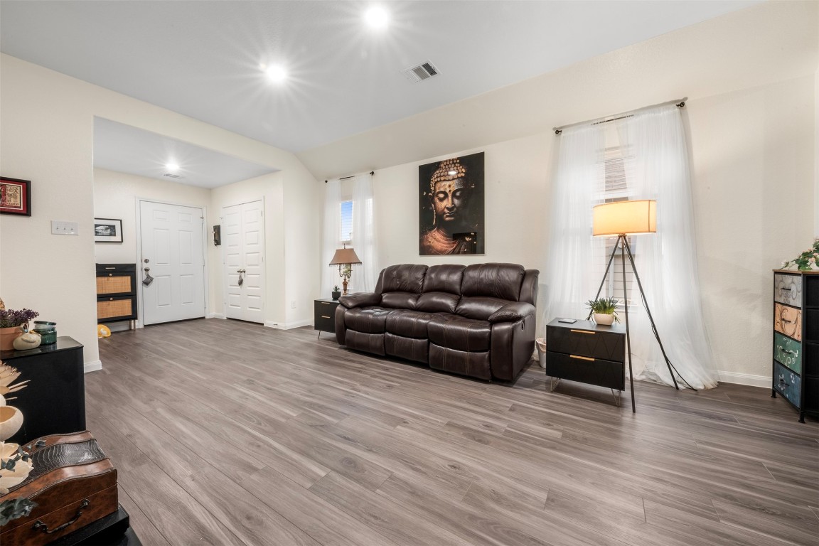 22565 Cormorant Court Splendora, TX 77372 - Photo 9 of 31 a living room with furniture and a wooden floor